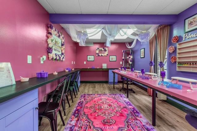 Modern spa interior with pink and purple color blocking
