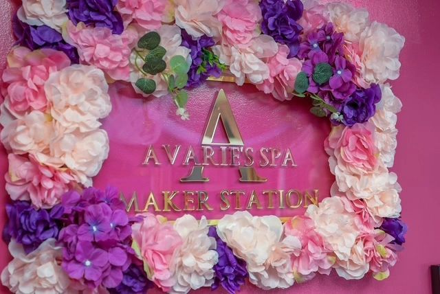 Avarie's Spa Maker Station sign with floral wall