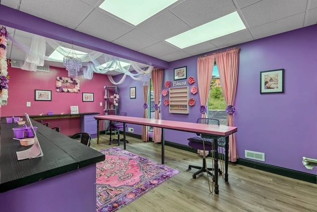 Spa venue interior with purple and pink walls
