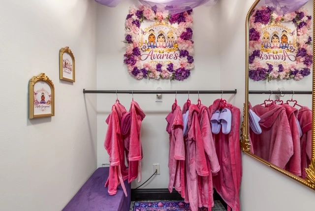 Boutique clothing rack with pink garments
