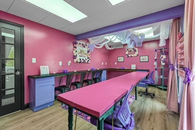 Colorful spa room with pink walls and purple accents
